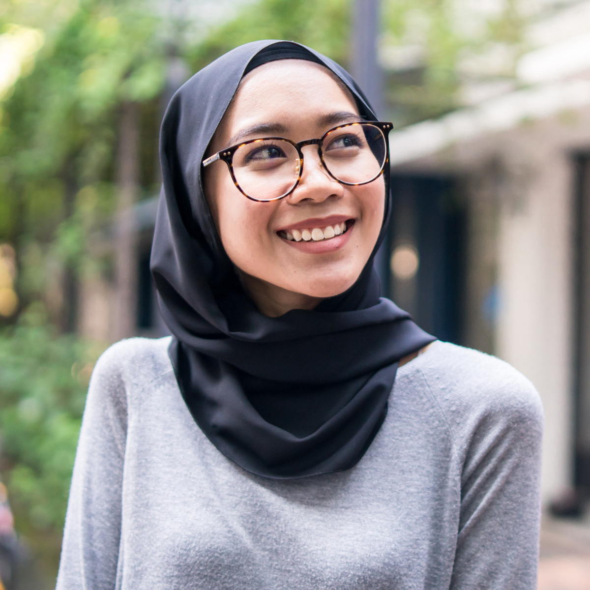 Smiling girl outside wearing eye glasses